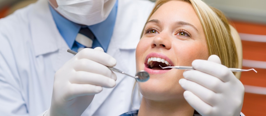 Woman getting dental check up
