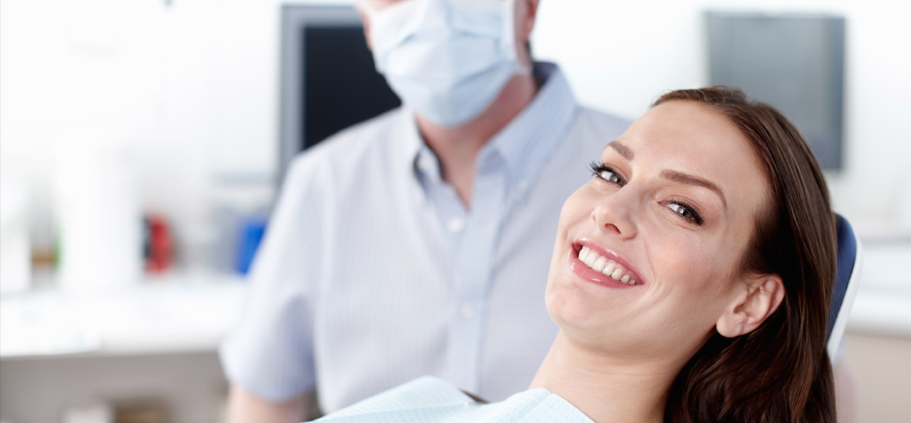 Woman Smiling at the Dental Clinic